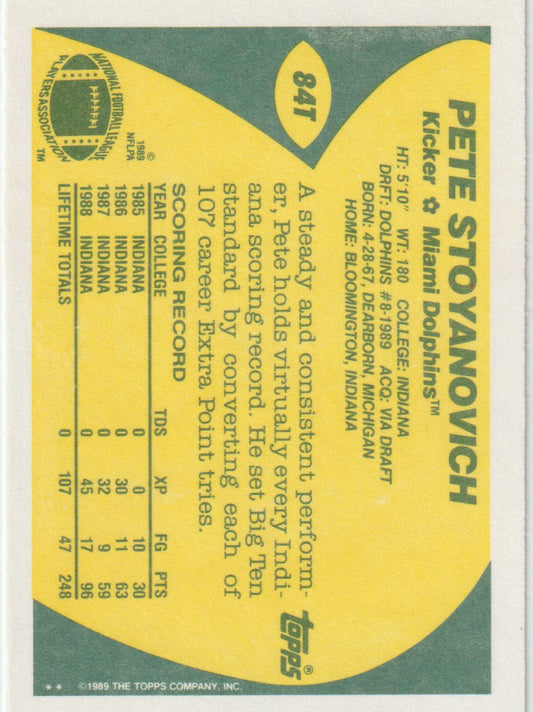 Vintage sports trading card of Pete Stoyanovich for the Miami Dolphins, featuring a yellow and green design.