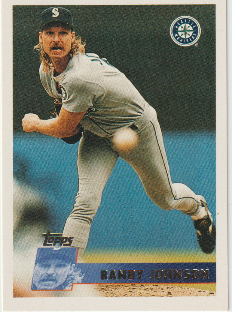 Baseball trading card of a pitcher in action with Topps logo