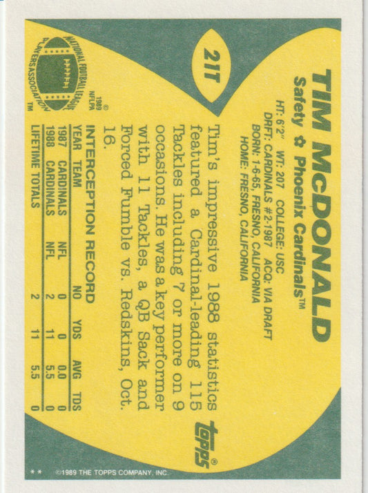 Vintage sports trading card for Tim McDonald of the Phoenix Cardinals with yellow and green design.