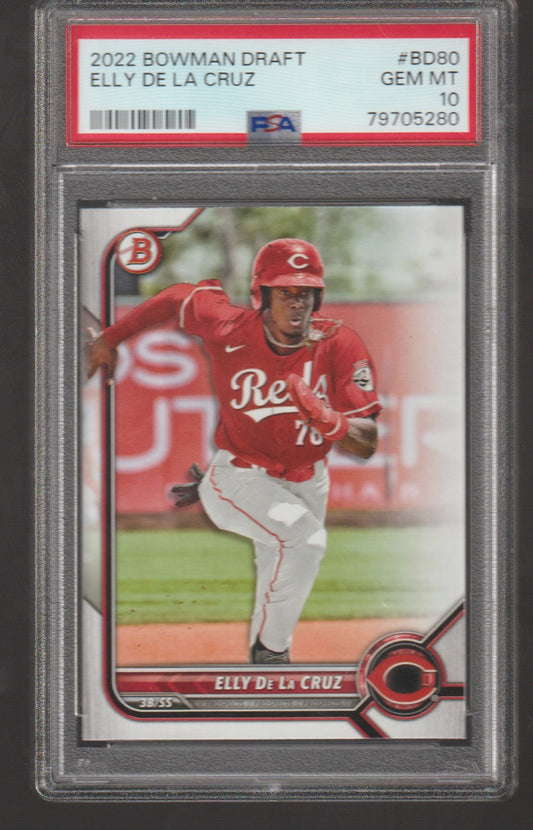 Baseball trading card of Elly de la Cruz in a red uniform with a PSA grading label.