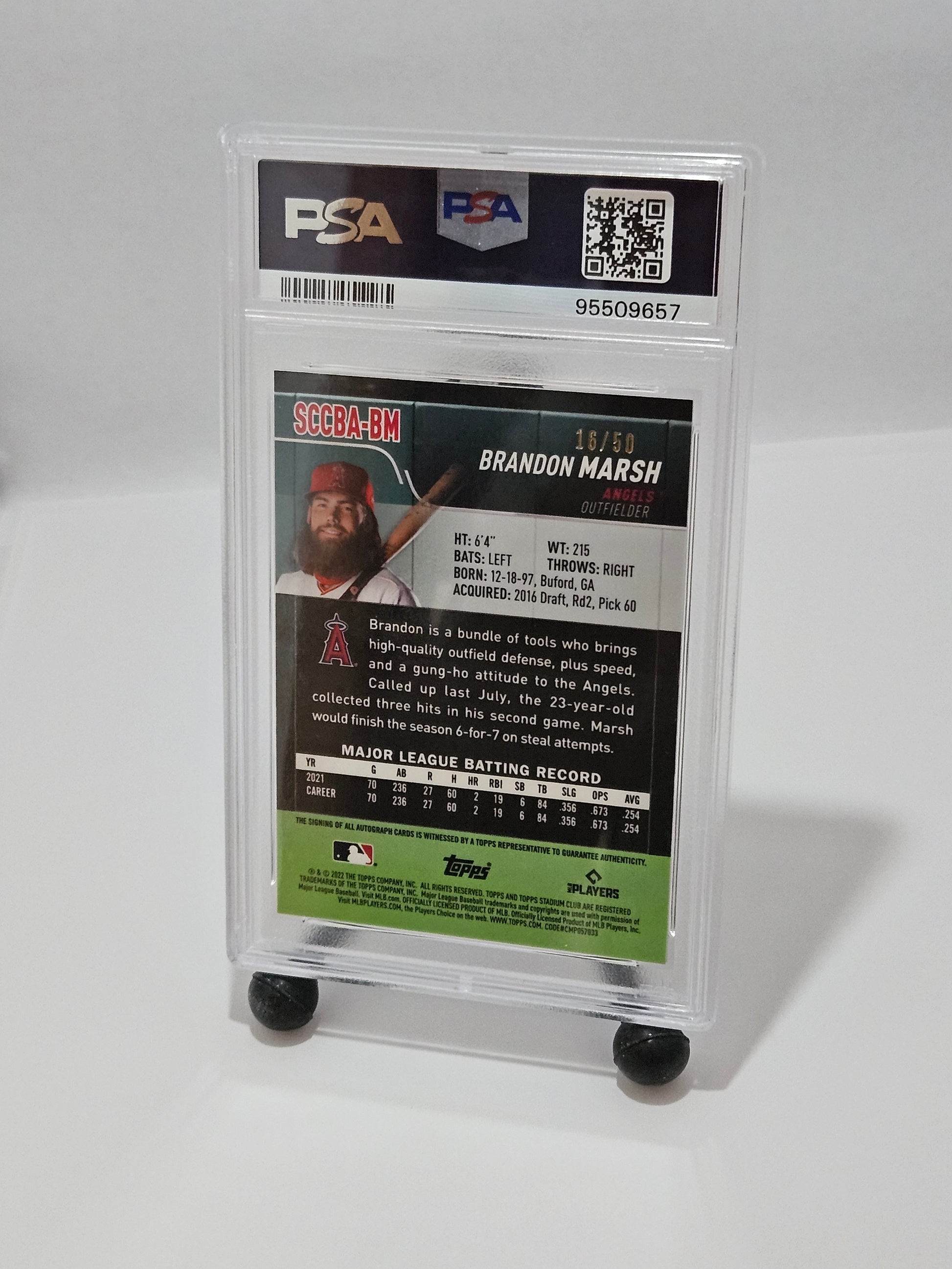 Baseball trading card in a protective case with PSA grading label on a white background