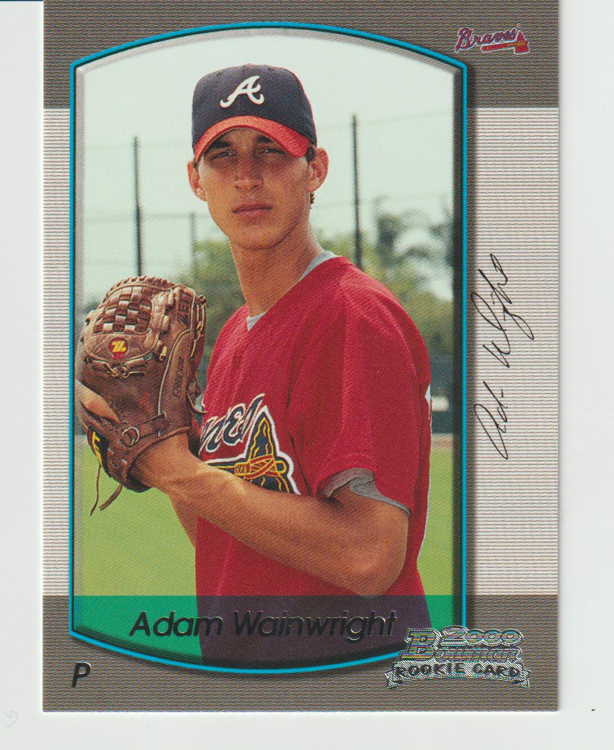 Baseball trading card of Adam Wainwright holding a glove, with a signature on the card.