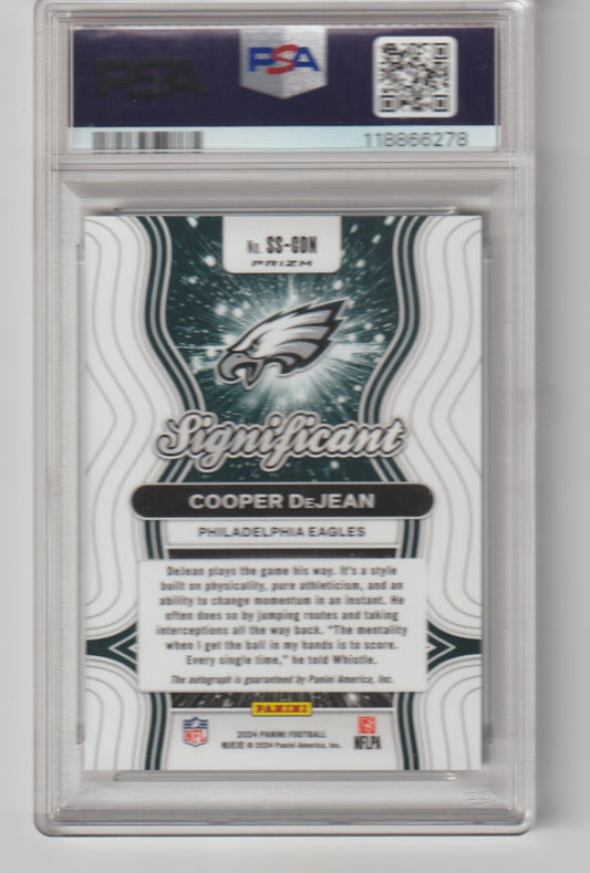 Trading card of Cooper DeJean with Philadelphia Eagles logo, encased in a PSA holder.