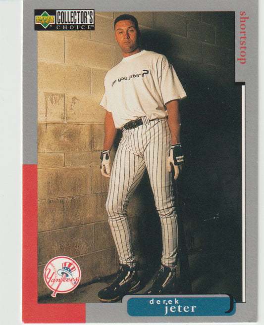 Baseball trading card of Derek Jeter in a pinstripe uniform against a brick wall.