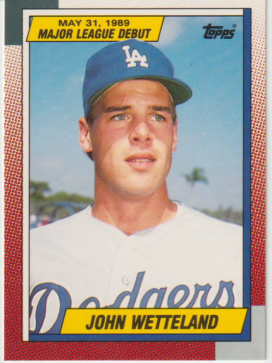 Baseball trading card of John Wetteland with a blue cap and white jersey, featuring Topps logo.