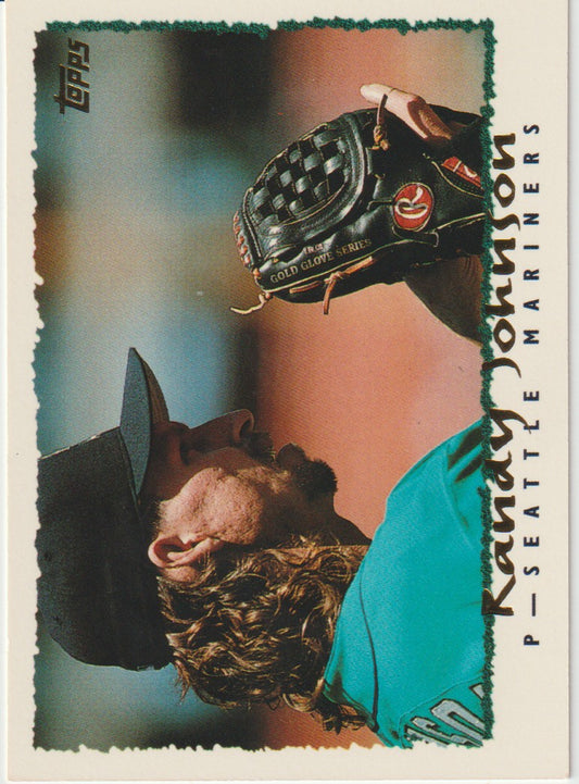 Baseball trading card of a player wearing a glove, with 'Topps' branding.