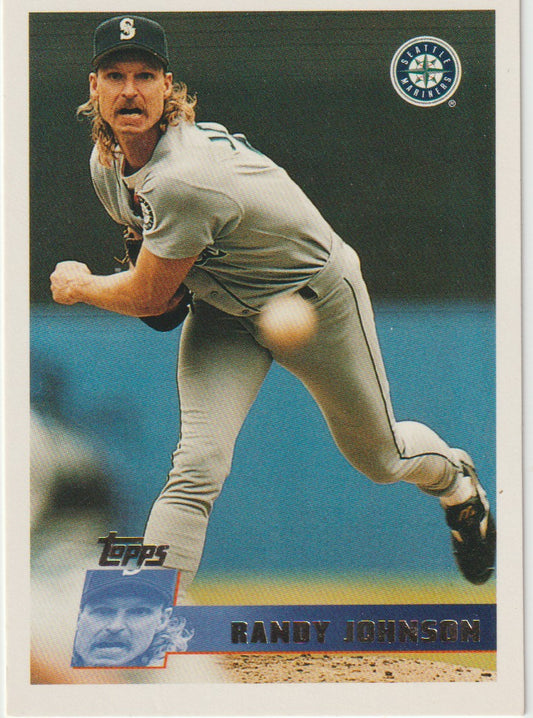 Baseball trading card of a pitcher in action with Topps logo