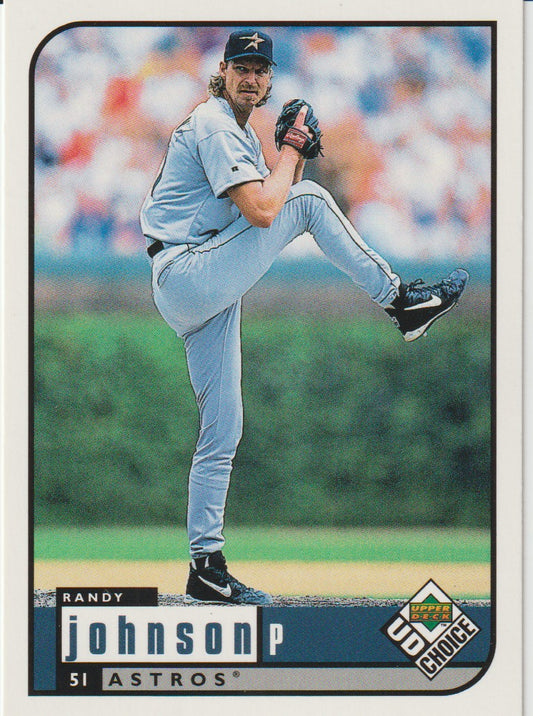 Baseball trading card of a pitcher in a light blue uniform with a blurred crowd in the background.