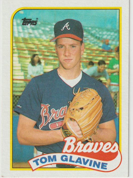 Baseball trading card of Tom Glavine holding a glove, with 'Braves' branding and Topps logo.