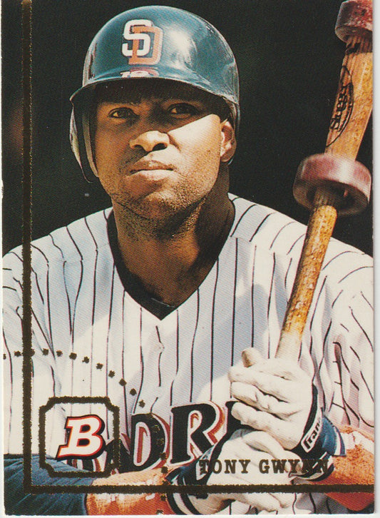 Baseball player holding a bat with a dark background